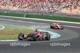 30.07.2006 Hockenheim, Germany,  Scott Speed (USA), Scuderia Toro Rosso, STR01 and Christijan Albers (NED), Midland MF1 Racing, Toyota M16 - Formula 1 World Championship, Rd 12, German Grand Prix, Sunday Race