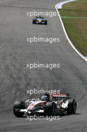 30.07.2006 Hockenheim, Germany,  Jenson Button (GBR), Honda Racing F1 Team RA106, leads Giancarlo Fisichella (ITA), Renault F1 Team R26 - Formula 1 World Championship, Rd 12, German Grand Prix, Sunday Race