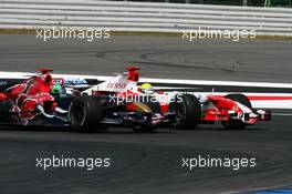 30.07.2006 Hockenheim, Germany,  Vitantonio Liuzzi (ITA), Scuderia Toro Rosso STR 01 and Ralf Schumacher (GER), Toyota Racing TF106, fighting for position - Formula 1 World Championship, Rd 12, German Grand Prix, Sunday Race