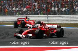 30.07.2006 Hockenheim, Germany,  Michael Schumacher (GER), Scuderia Ferrari 248 F1, leads Felipe Massa (BRA), Scuderia Ferrari 248 F1 - Formula 1 World Championship, Rd 12, German Grand Prix, Sunday Race