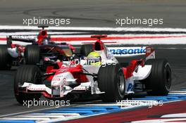 30.07.2006 Hockenheim, Germany,  Ralf Schumacher (GER), Toyota Racing TF106, leads Scott Speed (USA), Scuderia Toro Rosso STR 01- Formula 1 World Championship, Rd 12, German Grand Prix, Sunday Race
