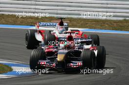30.07.2006 Hockenheim, Germany,  Vitantonio Liuzzi (ITA), Scuderia Toro Rosso, STR01 leads Jarno Trulli (ITA), Toyota Racing, TF106 - Formula 1 World Championship, Rd 12, German Grand Prix, Sunday Race