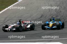 30.07.2006 Hockenheim, Germany,  Jenson Button (GBR), Honda Racing F1 Team RA106, outbrakes Giancarlo Fisichella (ITA), Renault F1 Team R26 at the hairpin - Formula 1 World Championship, Rd 12, German Grand Prix, Sunday Race