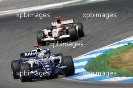 30.07.2006 Hockenheim, Germany,  Mark Webber (AUS), Williams F1 Team, FW28 Cosworth and Rubens Barrichello (BRA), Honda Racing F1 Team, RA106 - Formula 1 World Championship, Rd 12, German Grand Prix, Sunday Race