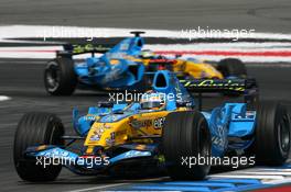 30.07.2006 Hockenheim, Germany,  Fernando Alonso (ESP), Renault F1 Team R26, leads Giancarlo Fisichella (ITA), Renault F1 Team R26 - Formula 1 World Championship, Rd 12, German Grand Prix, Sunday Race