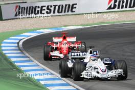30.07.2006 Hockenheim, Germany,  Jacques Villeneuve (CDN), BMW Sauber F1 Team, F1.06 and Michael Schumacher (GER), Scuderia Ferrari, 248 F1  - Formula 1 World Championship, Rd 12, German Grand Prix, Sunday Race