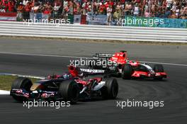 30.07.2006 Hockenheim, Germany,  Scott Speed (USA), Scuderia Toro Rosso STR 01, leads Christijan Albers (NED), Midland F1 Racing M16 - Formula 1 World Championship, Rd 12, German Grand Prix, Sunday Race