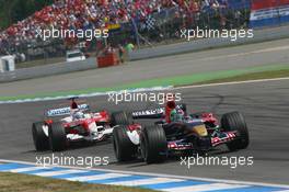 30.07.2006 Hockenheim, Germany,  Jarno Trulli (ITA), Toyota Racing, TF106 and Vitantonio Liuzzi (ITA), Scuderia Toro Rosso, STR01 - Formula 1 World Championship, Rd 12, German Grand Prix, Sunday Race