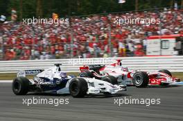 30.07.2006 Hockenheim, Germany,  Jacques Villeneuve (CDN), BMW Sauber F1 Team, F1.06 and Takuma Sato (JPN), Super Aguri F1, SA06 - Formula 1 World Championship, Rd 12, German Grand Prix, Sunday Race