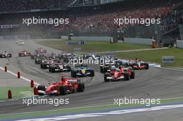 30.07.2006 Hockenheim, Germany,  Start, Kimi Raikkonen (FIN), Räikkönen, McLaren Mercedes, MP4-21  Michael Schumacher (GER), Scuderia Ferrari, 248 F1, Felipe Massa (BRA), Scuderia Ferrari, 248 F1 - Formula 1 World Championship, Rd 12, German Grand Prix, Sunday Race