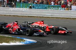 30.07.2006 Hockenheim, Germany,  Scott Speed (USA), Scuderia Toro Rosso STR 01 and Christijan Albers (NED), Midland F1 Racing M16, fighting for position - Formula 1 World Championship, Rd 12, German Grand Prix, Sunday Race
