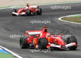 30.07.2006 Hockenheim, Germany,  Michael Schumacher (GER), Scuderia Ferrari, 248 F1 amnd Felipe Massa (BRA), Scuderia Ferrari, 248 F1 - Formula 1 World Championship, Rd 12, German Grand Prix, Sunday Race