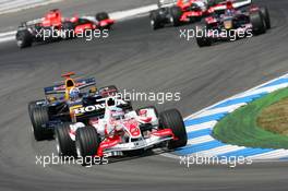 30.07.2006 Hockenheim, Germany,  Takuma Sato (JPN), Super Aguri F1, SA06 and David Coulthard (GBR), Red Bull Racing, RB2 - Formula 1 World Championship, Rd 12, German Grand Prix, Sunday Race