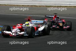 30.07.2006 Hockenheim, Germany,  Ralf Schumacher (GER), Toyota Racing TF106, leads Scott Speed (USA), Scuderia Toro Rosso STR 01 - Formula 1 World Championship, Rd 12, German Grand Prix, Sunday Race