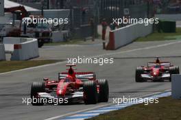 30.07.2006 Hockenheim, Germany,  Michael Schumacher (GER), Scuderia Ferrari, 248 F1 leads Felipe Massa (BRA), Scuderia Ferrari, 248 F1 - Formula 1 World Championship, Rd 12, German Grand Prix, Sunday Race