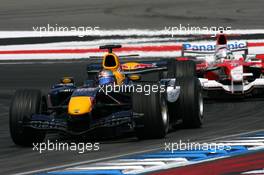 30.07.2006 Hockenheim, Germany,  Christian Klien (AUT), Red Bull Racing RB2, leads Jarno Trulli (ITA), Toyota Racing TF106 - Formula 1 World Championship, Rd 12, German Grand Prix, Sunday Race