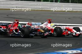 30.07.2006 Hockenheim, Germany,  Vitantonio Liuzzi (ITA), Scuderia Toro Rosso STR 01 and Ralf Schumacher (GER), Toyota Racing TF106, fighting for position - Formula 1 World Championship, Rd 12, German Grand Prix, Sunday Race