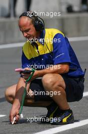29.07.2006 Hockenheim, Germany,  A Michelin Engineer checks the track temperature - Formula 1 World Championship, Rd 12, German Grand Prix, Saturday Practice