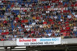 29.07.2006 Hockenheim, Germany,  Fans in the Grandstand and a pro Michael Schumacher (GER) banner- Formula 1 World Championship, Rd 12, German Grand Prix, Saturday Qualifying