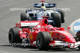 29.07.2006 Hockenheim, Germany,  Michael Schumacher (GER), Scuderia Ferrari ahead of Mark Webber (AUS), Williams F1 Team - Formula 1 World Championship, Rd 12, German Grand Prix, Saturday Practice