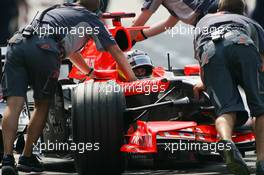 29.07.2006 Hockenheim, Germany,  Tiago Monteiro (POR), Midland MF1 Racing, Toyota M16, is pushed back into the garage - Formula 1 World Championship, Rd 12, German Grand Prix, Saturday Practice
