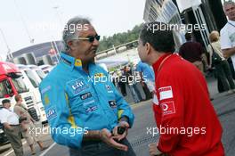 30.07.2006 Hockenheim, Germany,  Flavio Briatore (ITA), Renault F1 Team, Team Chief, Managing Director talking to Jean Todt (FRA), Scuderia Ferrari, Teamchief, General Manager, Team Principal - Formula 1 World Championship, Rd 12, German Grand Prix, Sunday