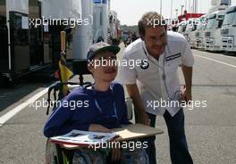 27.07.2006 Hockenheim, Germany,  Jacques Villeneuve (CDN), BMW Sauber F1 Team with a fan - Formula 1 World Championship, Rd 12, German Grand Prix, Thursday