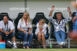 26.07.2006 Mannheim, Germany,  "Spiel des Herzens" - Corina Schumacher (GER), Corinna, Wife of Michael Schumacher is watching the game on the field, Willi Weber (GER), Driver Manager - Michael Schumacher (GER), Scuderia Ferrari - F1 Superstars (Michael Schumacher) plays against the RTL-Superstars, Charity, RTL Stiftung "Kinder in Not", UNESCO - Formula 1 World Championship, Rd 12, German Grand Prix, Wednesday