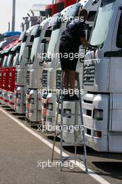 26.07.2006 Hockenheim, Germany,  Truckie cleaning the trucks- Formula 1 World Championship, Rd 12, German Grand Prix, Wednesday