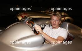 26.07.2006 Stuttgart, Germany,  Kimi Raikkonen (FIN), Räikkönen, McLaren Mercedesstand sits in a historical silver arrow at the Mercedes-Benz branch in Stuttgart. - DaimlerChrysler / Mercedes Media warm up - Formula 1 World Championship, Rd 12, German Grand Prix, Wednesday