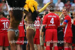 26.07.2006 Mannheim, Germany,  "Spiel des Herzens" - Michael Schumacher (GER), Scuderia Ferrari looking on the SAMBA GIRLS - F1 Superstars (Michael Schumacher) plays against the RTL-Superstars, Charity, RTL Stiftung "Kinder in Not", UNESCO - Formula 1 World Championship, Rd 12, German Grand Prix, Wednesday