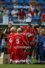 26.07.2006 Mannheim, Germany,  "Spiel des Herzens" - Michael Schumacher (GER), Scuderia Ferrari meets some young football players - F1 Superstars (Michael Schumacher) plays against the RTL-Superstars, Charity, RTL Stiftung "Kinder in Not", UNESCO - Formula 1 World Championship, Rd 12, German Grand Prix, Wednesday