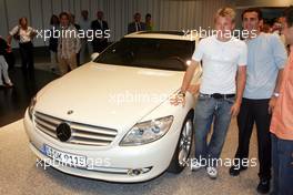 26.07.2006 Stuttgart, Germany,  Kimi Raikkonen (FIN), Räikkönen, McLaren Mercedes and Pedro de la Rosa (ESP), McLaren Mercedes present the new car CL600 at the Mercedes-Benz branch in Stuttgart. - DaimlerChrysler / Mercedes Media warm up - Formula 1 World Championship, Rd 12, German Grand Prix, Wednesday