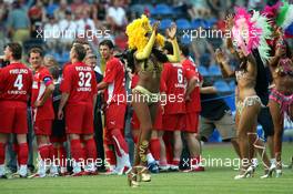 26.07.2006 Mannheim, Germany, "Spiel des Herzens" - Michael Schumacher (GER), Scuderia Ferrari looking on the SAMBA GIRLS - F1 Superstars (Michael Schumacher) plays against the RTL-Superstars, Charity, RTL Stiftung "Kinder in Not", UNESCO - Formula 1 World Championship, Rd 12, German Grand Prix, Wednesday