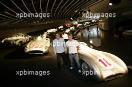 26.07.2006 Stuttgart, Germany,  (L-R) Pedro de la Rosa (ESP), McLaren Mercedes and Kimi Raikkonen (FIN), Räikkönen, McLaren Mercedesstand in front of historical silver arrows at the Mercedes-Benz branch in Stuttgart. - DaimlerChrysler / Mercedes Media warm up - Formula 1 World Championship, Rd 12, German Grand Prix, Wednesday