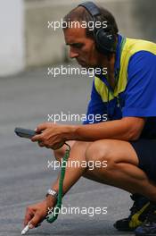 08.09.2006 Monza, Italy,  A Michelin tyre Engineer takes a temperature reading - Formula 1 World Championship, Rd 15, Italian Grand Prix, Friday Practice
