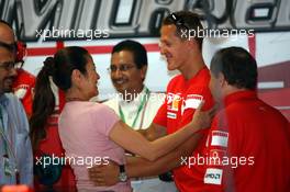 08.09.2006 Monza, Italy,  Michael Schumacher (GER), Scuderia Ferrari and Michelle Yeoh (MLY, ex. James Bond girl, actor) Girlfriend of Jean Todt - Formula 1 World Championship, Rd 15, Italian Grand Prix, Friday