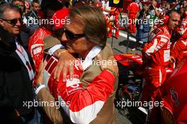 10.09.2006 Monza, Italy,  Luca di Montezemolo (ITA), Scuderia Ferrari, Fiat President, Chairman & Managing Director hugs Michael Schumacher (GER), Scuderia Ferrari - Formula 1 World Championship, Rd 15, Italian Grand Prix, Sunday Pre-Race Grid