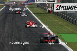 10.09.2006 Monza, Italy,  Start, Kimi Raikkonen (FIN), Räikkönen, McLaren Mercedes, MP4-21, Michael Schumacher (GER), Scuderia Ferrari, 248 F1, Robert Kubica (POL), BMW Sauber F1 Team, F1.06 - Formula 1 World Championship, Rd 15, Italian Grand Prix, Sunday Race