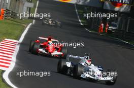 10.09.2006 Monza, Italy,  Robert Kubica (POL), BMW Sauber F1 Team, F1.06 and Felipe Massa (BRA), Scuderia Ferrari, 248 F1 - Formula 1 World Championship, Rd 15, Italian Grand Prix, Sunday Race