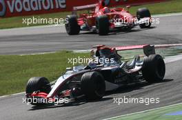 10.09.2006 Monza, Italy,  Kimi Raikkonen (FIN), Räikkönen, McLaren Mercedes, Michael Schumacher (GER), Scuderia Ferrari - Formula 1 World Championship, Rd 15, Italian Grand Prix, Sunday Race