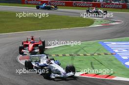 10.09.2006 Monza, Italy,  Robert Kubica (POL), BMW Sauber F1 Team, F1.06 and Felipe Massa (BRA), Scuderia Ferrari, 248 F1  - Formula 1 World Championship, Rd 15, Italian Grand Prix, Sunday Race