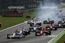 10.09.2006 Monza, Italy,  Start of the race - Kimi Raikkonen (FIN), Räikkönen, McLaren Mercedes, Nick Heidfeld (GER), BMW Sauber F1 Team, Michael Schumacher (GER), Scuderia Ferrari - Formula 1 World Championship, Rd 15, Italian Grand Prix, Saturday Qualifying