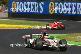 10.09.2006 Monza, Italy,  Rubens Barrichello (BRA), Honda Racing F1 Team, RA106  and Felipe Massa (BRA), Scuderia Ferrari, 248 F1 - Formula 1 World Championship, Rd 15, Italian Grand Prix, Sunday Race