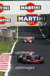 10.09.2006 Monza, Italy,  Kimi Raikkonen (FIN), Räikkönen, McLaren Mercedes, MP4-21 and Michael Schumacher (GER), Scuderia Ferrari  - Formula 1 World Championship, Rd 15, Italian Grand Prix, Sunday Race