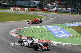 10.09.2006 Monza, Italy,  Kimi Raikkonen (FIN), Räikkönen, McLaren Mercedes, MP4-21 and Michael Schumacher (GER), Scuderia Ferrari, 248 F1  - Formula 1 World Championship, Rd 15, Italian Grand Prix, Sunday Race