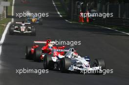 10.09.2006 Monza, Italy,  Robert Kubica (POL), BMW Sauber F1 Team, F1.06 and Felipe Massa (BRA), Scuderia Ferrari, 248 F1 - Formula 1 World Championship, Rd 15, Italian Grand Prix, Sunday Race