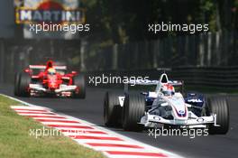 10.09.2006 Monza, Italy,  Robert Kubica (POL), BMW Sauber F1 Team, F1.06 and Felipe Massa (BRA), Scuderia Ferrari, 248 F1 - Formula 1 World Championship, Rd 15, Italian Grand Prix, Sunday Race