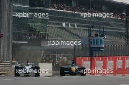 10.09.2006 Monza, Italy,  Robert Kubica (POL), BMW Sauber F1 Team, F1.06 and Fernando Alonso (ESP), Renault F1 Team, R26, exit the pitlane - Formula 1 World Championship, Rd 15, Italian Grand Prix, Sunday Race