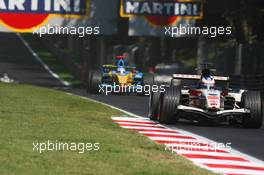 10.09.2006 Monza, Italy,  Jenson Button (GBR), Honda Racing F1 Team, RA106 and Giancarlo Fisichella (ITA), Renault F1 Team, R26 - Formula 1 World Championship, Rd 15, Italian Grand Prix, Sunday Race